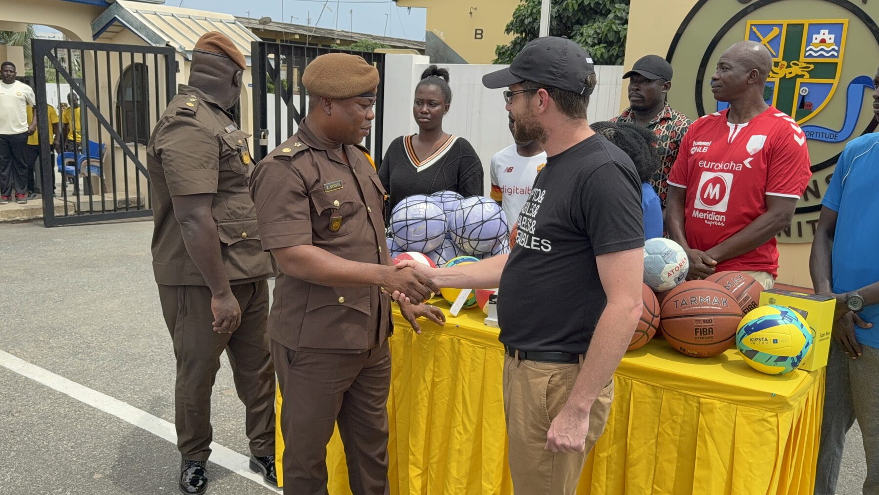 Kevin Frey presenting donated sports equipment in Accra